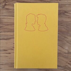 Yellow Hardcover Book with Red Silhouette Design